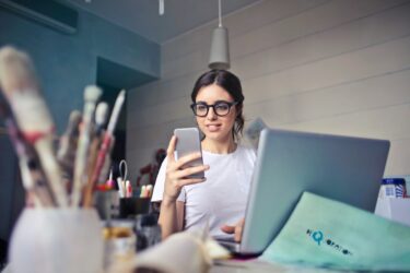 A woman using her cellphone.